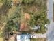 Top down view of house with large trees, defined property line at 9608 Theresa Dr, Thonotosassa, FL 33592