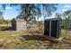 Fenced backyard with two storage sheds offering practical outdoor storage at 9608 Theresa Dr, Thonotosassa, FL 33592