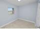 Bright bedroom with tile flooring and a window, providing natural light at 9608 Theresa Dr, Thonotosassa, FL 33592