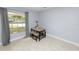 Dining nook with tile flooring, neutral paint, and window with views of exterior at 9608 Theresa Dr, Thonotosassa, FL 33592