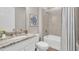 Clean bathroom with a bathtub and granite countertop at 1970 Blackwood Cir, North Port, FL 34286