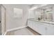Elegant bathroom with double vanity, granite countertop, and walk-in shower at 1970 Blackwood Cir, North Port, FL 34286
