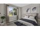 Bedroom with a queen-size bed and large window at 1970 Blackwood Cir, North Port, FL 34286