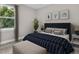 Spacious bedroom with a king-size bed and plenty of natural light at 1970 Blackwood Cir, North Port, FL 34286
