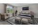 Main bedroom with sitting area and ample natural light at 1970 Blackwood Cir, North Port, FL 34286