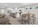 Bright kitchen boasts an island with seating, stainless steel appliances, and adjacent dining area at 1970 Blackwood Cir, North Port, FL 34286