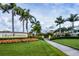 Gran Paradiso community entrance with palm trees and landscaping at 20625 Romagna Pl, Venice, FL 34293