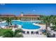 Resort-style pool with expansive sundeck and adjacent clubhouse at 20625 Romagna Pl, Venice, FL 34293