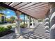 Pathway with pergola leading to the pool area at 20625 Romagna Pl, Venice, FL 34293