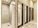Clean and modern shower facilities with tiled walls and curtains at 20625 Romagna Pl, Venice, FL 34293