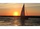 Sailboat on the water at sunset at 20625 Romagna Pl, Venice, FL 34293