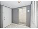 Bright entryway with white door and gray walls at 266 Cerromar S Way # 55, Venice, FL 34293