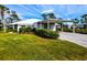 House with carport and manicured hedges at 266 Cerromar S Way # 55, Venice, FL 34293