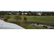 View of a lush green golf course with water features at 448 Cerromar Rd # 286, Venice, FL 34293