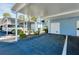 Covered parking area with carport and storage unit at 448 Cerromar Rd # 286, Venice, FL 34293