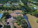 Aerial view of home featuring a private pool and scenic landscaping at 1061 Owl Dr, Englewood, FL 34223