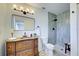 Updated bathroom with designer vanity and walk-in shower at 1061 Owl Dr, Englewood, FL 34223