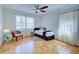 Bedroom featuring ample light, parquet floors, and neutral decor at 1061 Owl Dr, Englewood, FL 34223