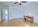 Bedroom featuring closet, ceiling fan, and parquet floors at 1061 Owl Dr, Englewood, FL 34223