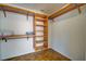 Walk-in closet features built in wooden shelving and organizers at 1061 Owl Dr, Englewood, FL 34223