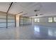 Spacious garage with two bay doors and speckled epoxy floors at 1061 Owl Dr, Englewood, FL 34223