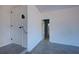 Spacious garage featuring epoxy floors, white walls, and convenient access doors at 1061 Owl Dr, Englewood, FL 34223