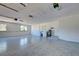 Spacious garage featuring laundry area and speckled epoxy floors at 1061 Owl Dr, Englewood, FL 34223