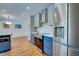 Open kitchen showcases stainless steel appliances, modern lighting, and an adjacent dining area at 1061 Owl Dr, Englewood, FL 34223