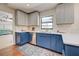 Charming kitchen features two-tone cabinets, stainless steel appliances and beautiful countertops at 1061 Owl Dr, Englewood, FL 34223