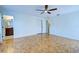 Main bedroom with parquet floors, large closet, and access to an ensuite bath at 1061 Owl Dr, Englewood, FL 34223