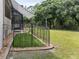 Landscaped backyard with fenced-in area for pets at 5515 Reisterstown Rd, North Port, FL 34291