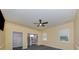 Comfortable bedroom with a ceiling fan and plenty of closet space at 5515 Reisterstown Rd, North Port, FL 34291