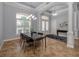 Bright dining room with tile floors and a large glass table at 5515 Reisterstown Rd, North Port, FL 34291