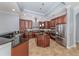 Spacious kitchen featuring granite countertops and stainless steel appliances at 5515 Reisterstown Rd, North Port, FL 34291