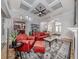 Relaxing living room with red leather sofas and a ceiling fan at 5515 Reisterstown Rd, North Port, FL 34291