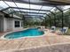 Relaxing pool and spa with covered patio at 5515 Reisterstown Rd, North Port, FL 34291