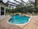 Inviting pool and spa with covered patio at 5515 Reisterstown Rd, North Port, FL 34291