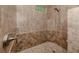 Walk-in shower with tiled walls and a built-in seat at 5515 Reisterstown Rd, North Port, FL 34291