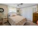 Bright bedroom with a queen-size bed and wood dresser at 566 Viridian St, Englewood, FL 34223