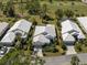 Aerial view of single-Gathering home with golf course views and lush landscaping at 344 Bermuda Ct # 4, Venice, FL 34293