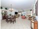 Spacious dining room with a large table and chandelier at 344 Bermuda Ct # 4, Venice, FL 34293