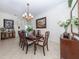 Elegant dining room, complete with a formal table and chairs at 344 Bermuda Ct # 4, Venice, FL 34293