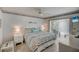 Main bedroom with king-size bed and private balcony access at 429 Wexford Cir # 75, Venice, FL 34293