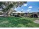 Single-story home with carport, spacious lawn and mature trees at 429 Wexford Cir # 75, Venice, FL 34293