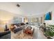 Living area with brown leather sofa, coffee table and view of patio at 429 Wexford Cir # 75, Venice, FL 34293