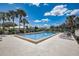 Inviting community pool surrounded by lush landscaping at 429 Wexford Cir # 75, Venice, FL 34293