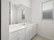 Bathroom with vanity, large mirror, and tile floor at 664 Silk Oak Dr, Venice, FL 34293