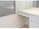 White bathroom vanity with single drawer and countertop at 664 Silk Oak Dr, Venice, FL 34293