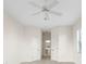 Bright bedroom with two doors and ceiling fan at 664 Silk Oak Dr, Venice, FL 34293