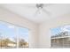 Well-lit bedroom with two windows and a ceiling fan at 664 Silk Oak Dr, Venice, FL 34293